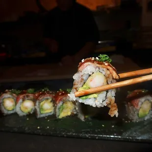 The Godzilla roll was made with tempura shrimp, avocado, seared NY strip, and black garlic butter.