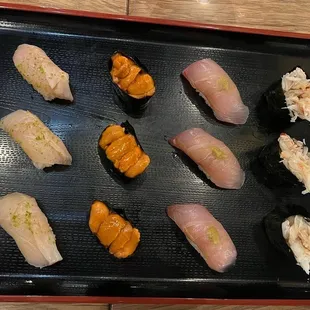a variety of sushi on a tray