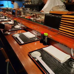 Sushi bar seating is spacious and comfortable.