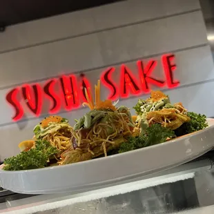 a plate of noodles and vegetables