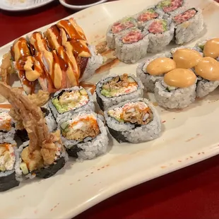 various types of sushi on a plate