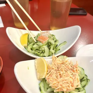 two plates of food on a red table