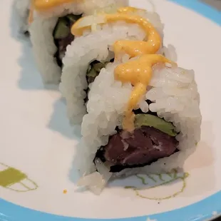 a sushi roll on a plate