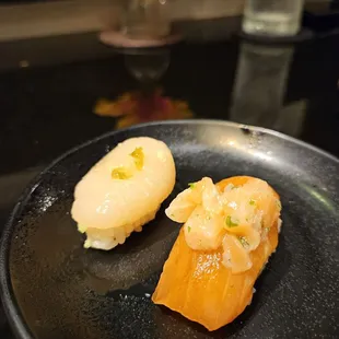 Salmon topped with salmon ceviche? Why? Sub par quality fish and scallops used. Sauce all over.