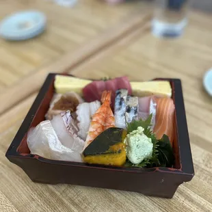 a close up of a sushi box