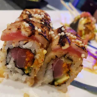 two pieces of sushi on a plate