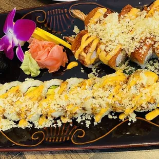 a plate of sushi and rolls