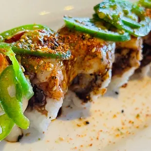 a closeup of a sushi roll on a white plate