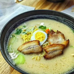 a bowl of ramen with a hard boiled egg