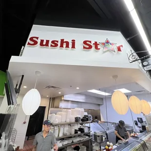 customers at the counter of a sushi star restaurant