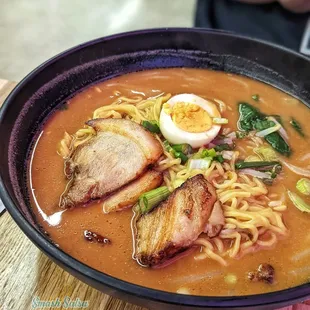 a bowl of ramen with a hard boiled egg