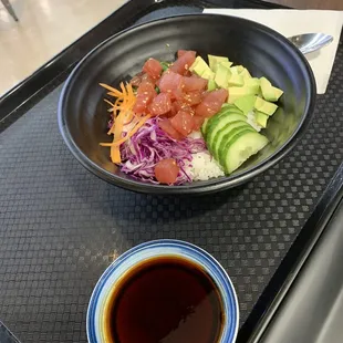 a bowl of salad and a bowl of sauce