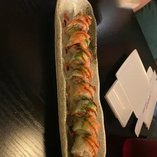 a long hot dog on a bun