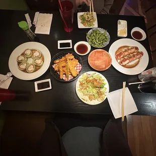 Mixed tempura, house green salad, oh baby roll, garlic edamame and rollgasm.