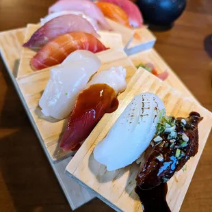 Nigiri. 10 pieces for $32. Eel, Squid, Surf Clam (special), Scallop, Beet Salmon, Yellowtail, Amberjack, Red Snapper, Tuna, Salmon.