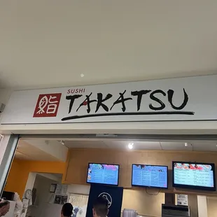 a group of people in a restaurant
