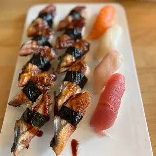 a plate of different types of sushi