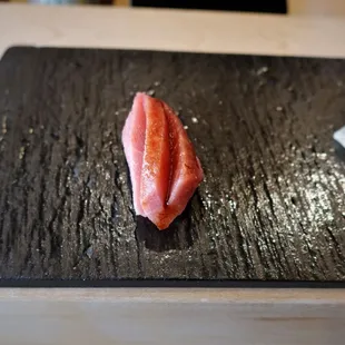 a piece of tuna on a cutting board