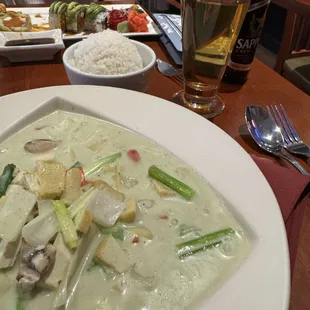 Green coconut curry with tofu added.  This dish comes with a side bowl of white rice.