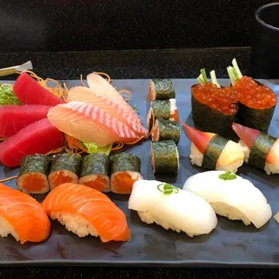 A well plated lunch of sushi and sashimi.