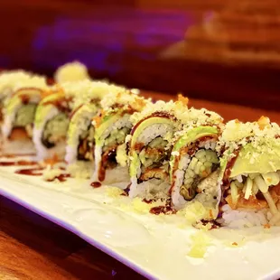 Green Dragon Roll: 8 pieces. Eel and cucumber, topped with avocado, crunch, and eel sauce.