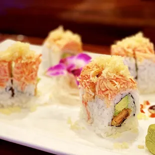 Under Control Roll: 8 pieces. Salmon &amp; avocado tempura, topped with spicy crab.