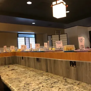 the counter area of a sushi restaurant