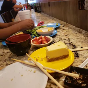 Cheesecake, strawberries, cantalopes, spring roles, miso soup and edamame.