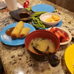 Edamame, spring rolls, fresh fruit, and miso