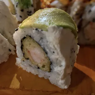 Godzilla - shrimp tempura inside topped with eel, avocado, and cream cheese.