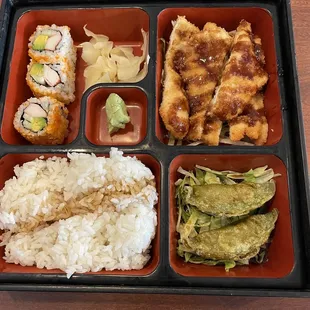 Bento Box Lunch: Vegetable Gyoza, Chicken Katsu, California Roll, Rice.