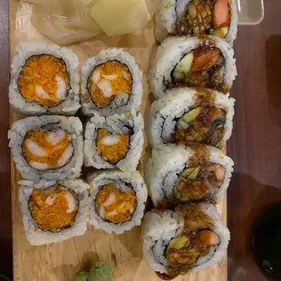a variety of sushi on a cutting board