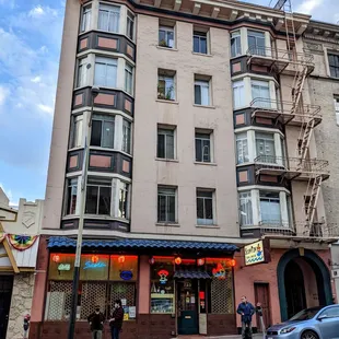 people walking in front of a building