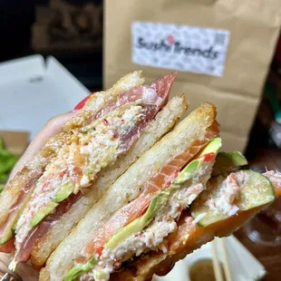 The sushi sandwich - so good, crispy rice for bread and loaded w salmon, tuna, crab and avocado.