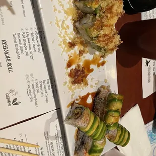a plate of sushi rolls on a table