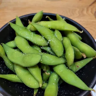 a bowl of edamants on a table