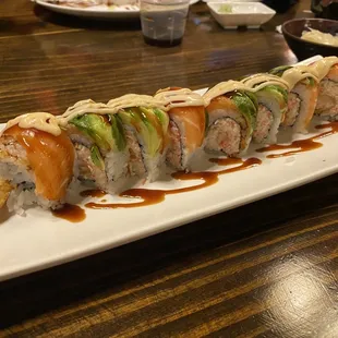 Katana Roll - Crab mix, shrimp tempura, topped with salmon, avocado, may, kawari, eel sauce.