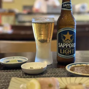 a bottle of sappor light and a plate of food
