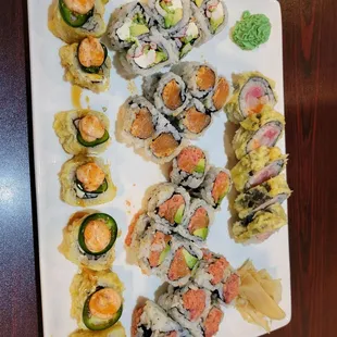 a platter of sushi and rolls