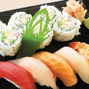 a plate of sushi and rolls