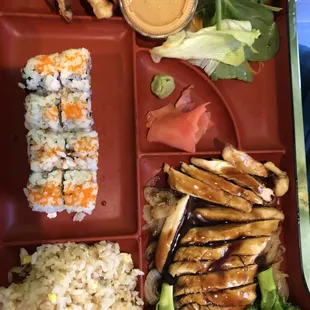 a bento box with a variety of food items