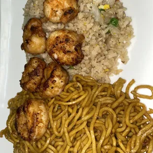 a plate of noodles and scallops