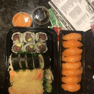 6 Piece Tuna Avocado Roll, Spider Roll and Crunchy roll on left. 8 pieces of salmon sushi on right.