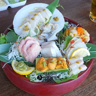 Check out this Sashimi setup. Fresh Bluefin Toro, Uni, Yellowtail Belly, Red Snapper, Halibut, Tsubugai, and a special Tako salad.