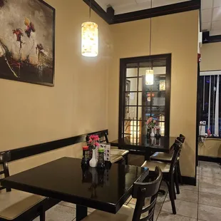 a dining area with tables and chairs