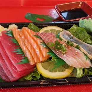 Actual sashimi deluxe. Slice diagonal so thin I can almost see thru it.  Nothing like the picture.