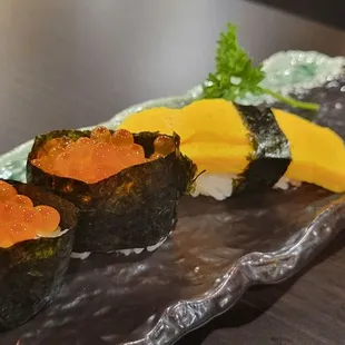 Salmon roe (ikura) sushi and egg (tamago) sushi