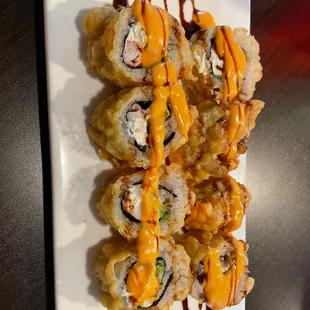 a plate of sushi rolls