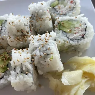 a plate of sushi rolls