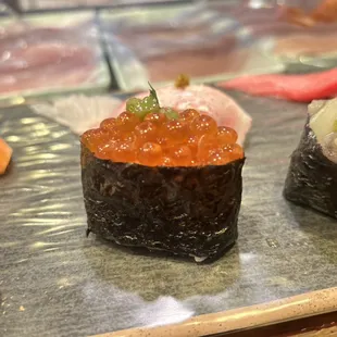 Homemade salmon egg with gizami wasabi and Japanese mint leaf